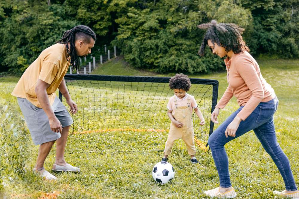 family playing soccer