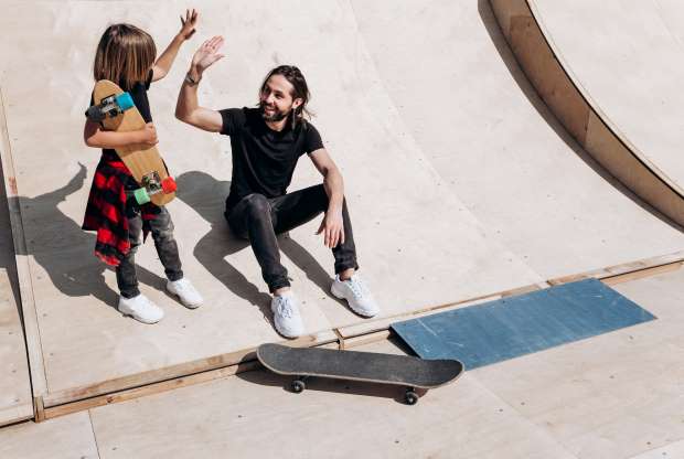 girl learning skateboarding