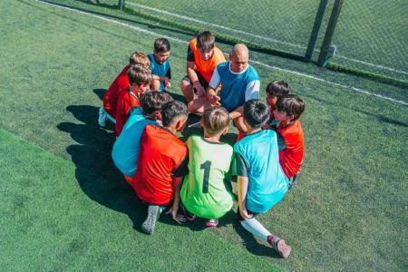 coach with kids sports team