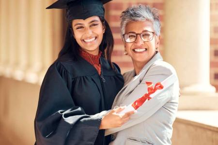 student graduating smiling