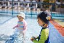 kids swimming in the sun