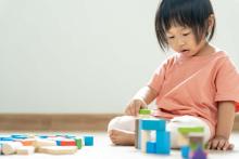 child playing with toys 9-24