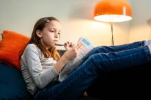 girl solving sudoku puzzle