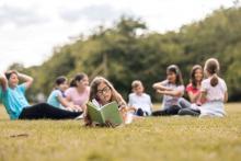 kid reading a book