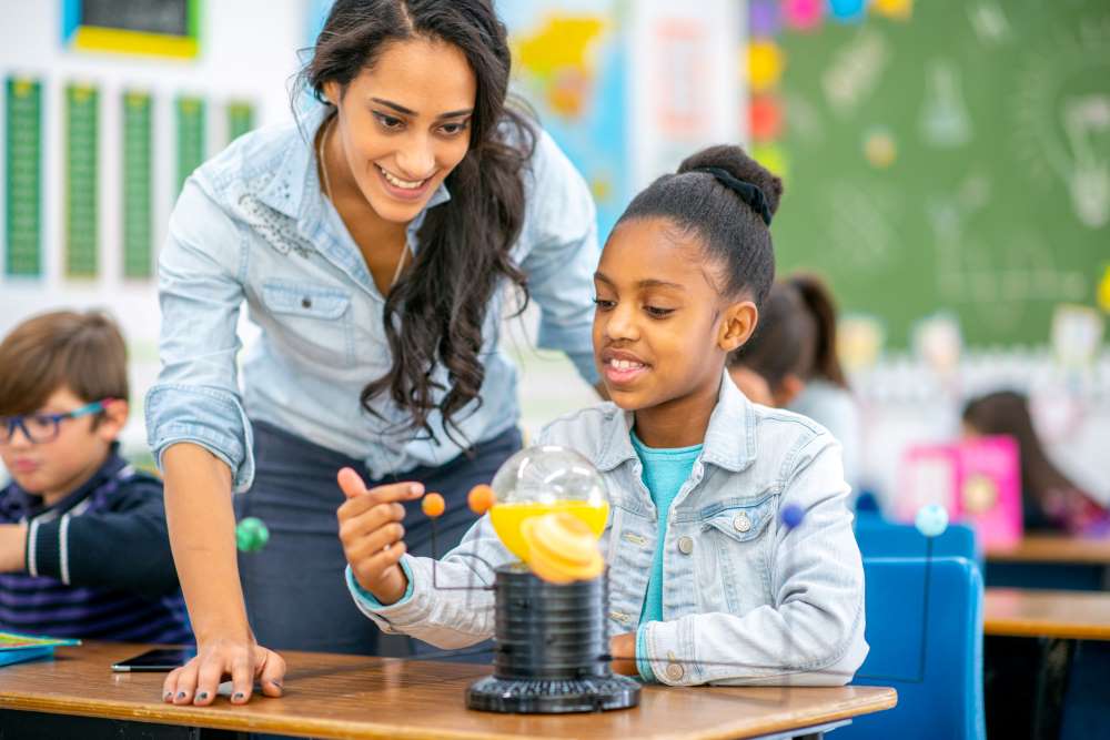 teacher helping student