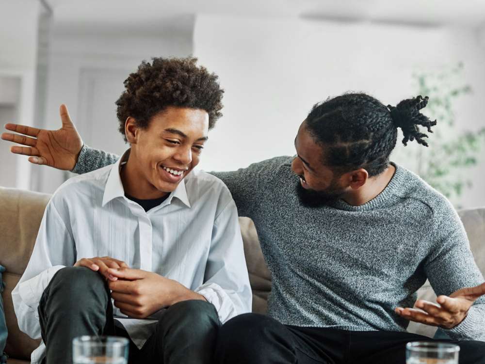 teen and father having a conversation