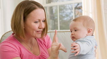 Does sign language replace speaking to my baby?